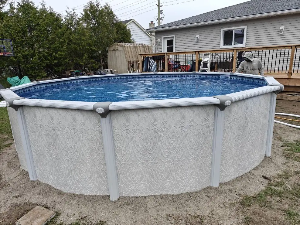 Completed above-ground pool installation by Lakeshore Pool & Deck