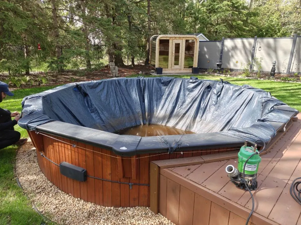 Old vinyl pool liner being removed